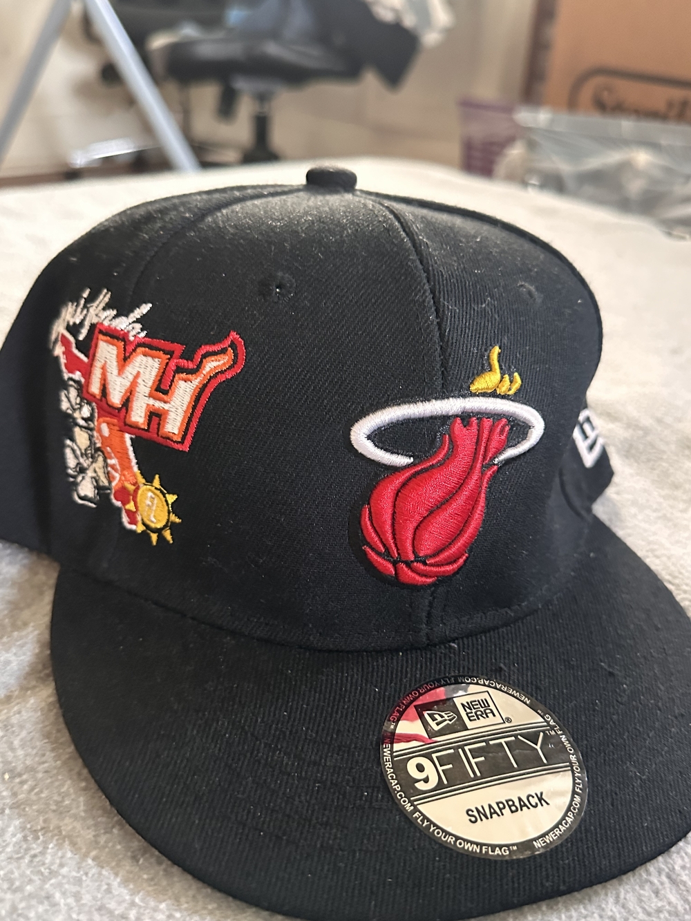 New Era Black Miami Heat Snapback Hat with Red Logo